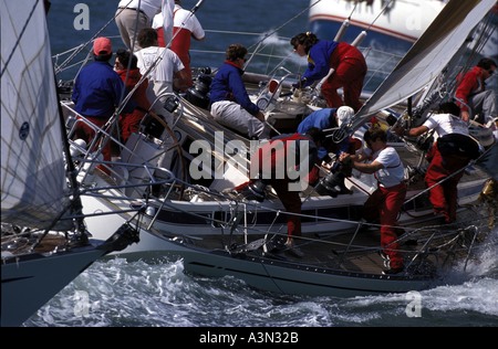 Teamwork onboard a sailing yacht racing in a regatta Stock Photo