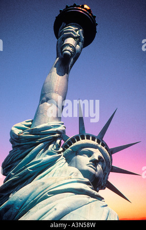Statue of Liberty close up, New York landmark monument, low angle view at sunset. USA Stock Photo