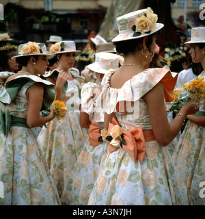 GROUP OF YOUNG WOMEN WITH FLOWERY DRESS AND HAT AT SPRING FLOWER FESTIVAL  FUNCHAL  MADEIRA  ISLAND PORTUGAL Stock Photo