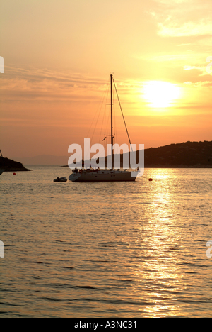 Yacht at Sunset Moored in Bay at Soline off Otok Pasman Island Croatia Stock Photo