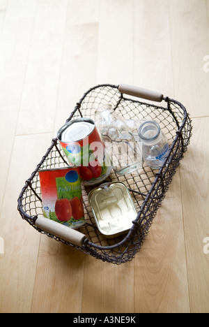 Empty bottles and cans in a basket Stock Photo