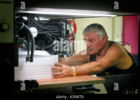 A worker in a printing house Stock Photo