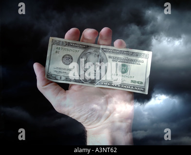Hand holding money US twenty dollar bill Stock Photo