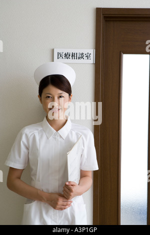 portrait of female nurse standing in hospital corridor Stock Photo - Alamy