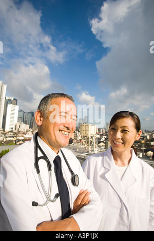 Doctors talking on roof Stock Photo