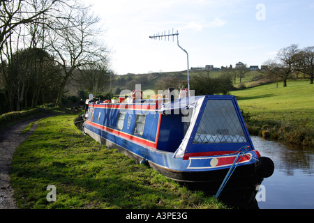 A Narrow Boat moored on the Peak Forest Canal near Marple in Cheshire Stock Photo