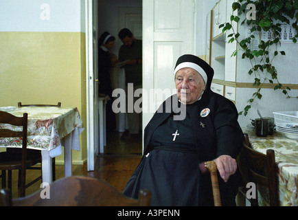 Elderly nun sitting in a dining room of the cloister in Komancza, Poland Stock Photo