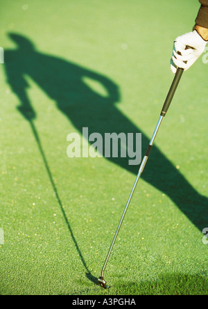 Shadow of golfer Stock Photo