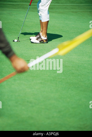Golfer putting Stock Photo