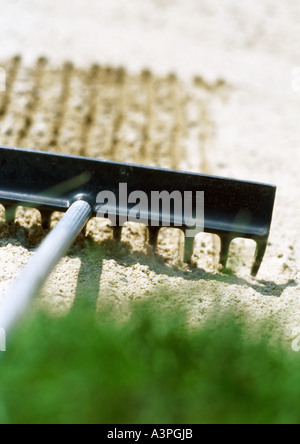 Rake on sand trap, close-up Stock Photo