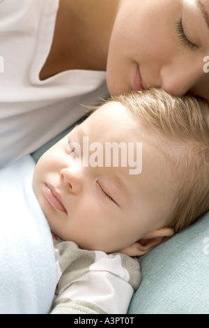 mum and infant sleeping together Stock Photo