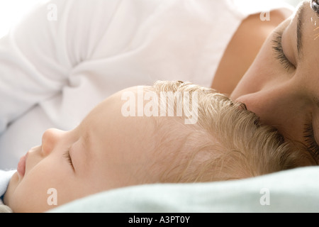 mum and infant sleeping together Stock Photo
