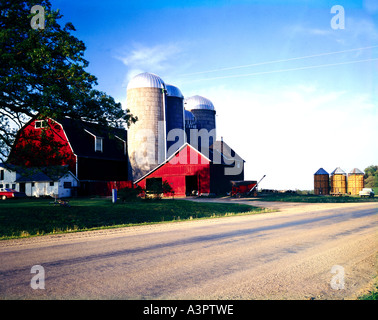 Wisconsin dairy farm with silos barns and outbuildings surrounded by ...