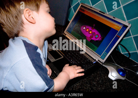 Child navigating laptop Stock Photo