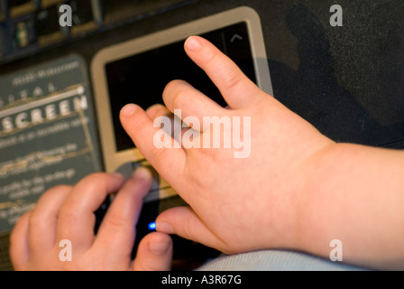 Hands Forearms fingers child using a laptop Stock Photo