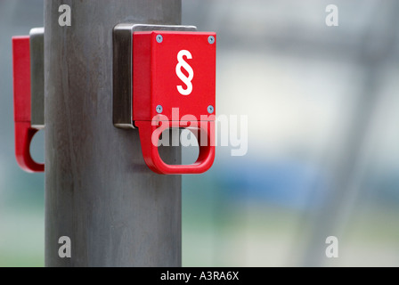 red emergency brake marked with paragraph Stock Photo
