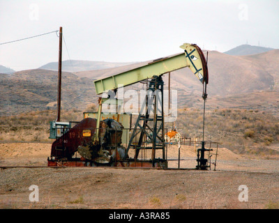 Elk Hills oil field near Coalinga California where the pumpers are painted like cartoon animals located area where endangered species live Stock Photo