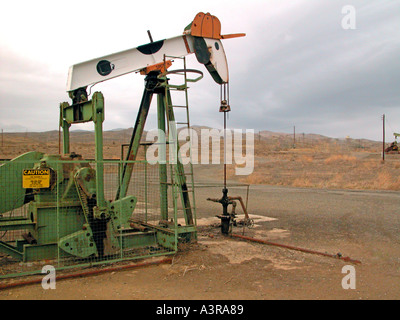 Elk Hills oil field near Coalinga California where the pumpers are painted like cartoon animals located area where endangered species live Stock Photo