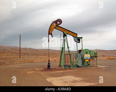 Elk Hills oil field near Coalinga California where the pumpers are painted like cartoon animals located area where endangered species live Stock Photo