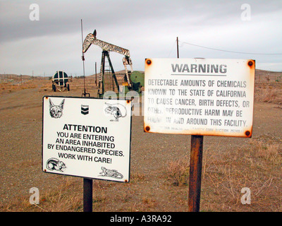 Elk Hills oil field near Coalinga California where the pumpers are painted like cartoon animals located area where endangered species live Stock Photo