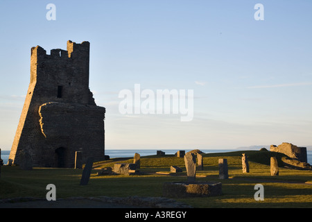 13th century Aberystwyth Castle ruin with remains of Porth Newydd or New Gate on Castle Point with sea beyond Stock Photo