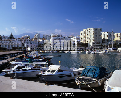 PLEASURE BOATS in the MARINA seafront hotels beyond harbour Estepona Malaga Andalucia Spain Stock Photo