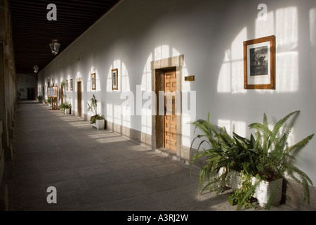 The light from glazed window on wall of an old corridor San Lorenzo de El Escorial Madrid Spain Stock Photo