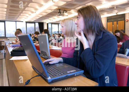 women students taking notes on laptop computers during a lecture in Law department Aberystwyth university Wales UK Stock Photo