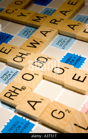 WELSH language version of scrabble word board game showing double letter tiles Stock Photo