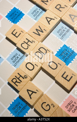 WELSH language version of scrabble word board game showing double letter tiles digraphs Stock Photo