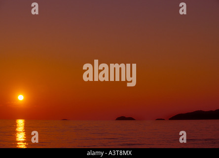 The sun sets over Lake Superior at Agawa Bay in Lake Superior Provincial Park near Wawa Ontario Stock Photo