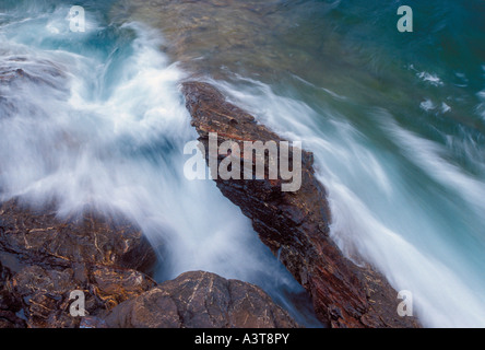 Lake Superior waves crash on the rugged shoreline of Presque Isle Park in Marquette Mich Stock Photo