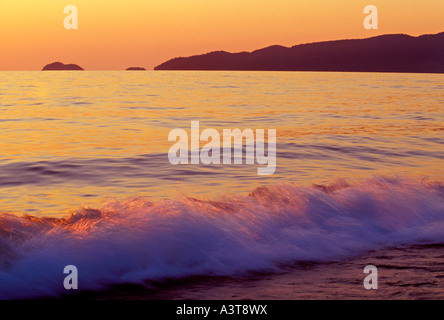 Lake Superior waves crash on Agawa Beach at dusk in Lake Superior Provincial Park near Wawa Ontario Stock Photo