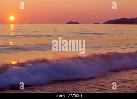 Lake Superior waves crash on Agawa Beach at sunset in Lake Superior Provincial Park near Wawa Ontario Stock Photo