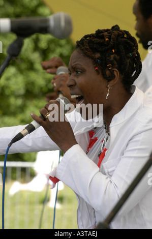 aberystwyth arts centre summer festival 'midsummer madness' black woman singer performing on stage holding microphone , wales UK Stock Photo