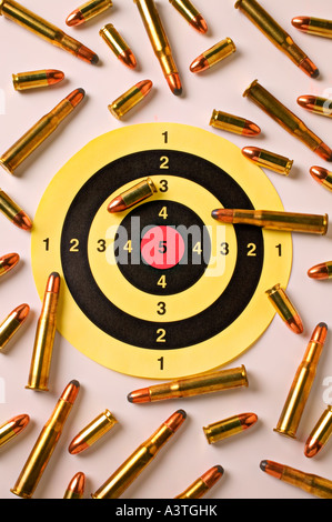 Yellow target with bullets Stock Photo