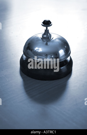 Hotel Desk Clerk Bell Stock Photo