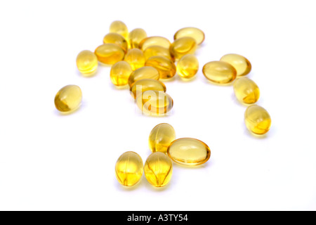 Evening primrose oil capsules isolated on a white studio background. Stock Photo