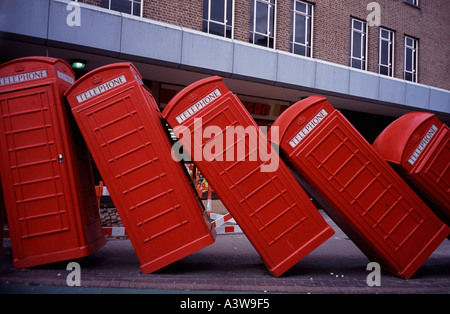 Out of Order - toppled telephone boxes sculpture in Old London Road Kingston upon Thames Surrey UK Stock Photo