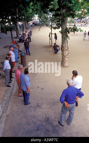 People playing bowls boules at a park in I lle Rousse Corsica Island France Stock Photo