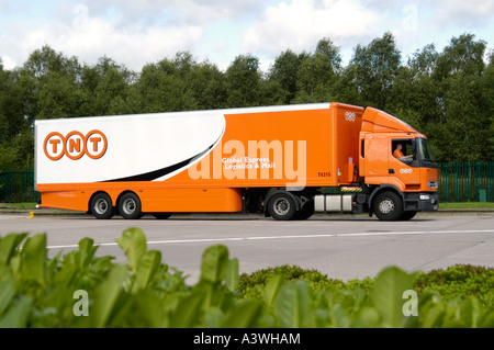 Renault 370 articulated lorry in TNT courier livery in the UK. Stock Photo