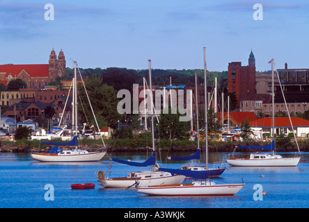 Sailboats anchor in the lower harbor of Marquette Mich Stock Photo