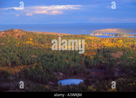 Fall color is seen on the landscape looking east toward Marquette from atop Hogback Mountain Stock Photo