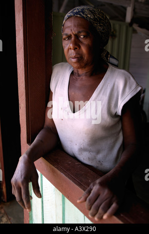 A Cuban woman stands at her porch in the village of Vinales, Pinar del Rio province, Cuba West Indies. Stock Photo