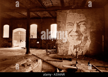 Portrait of former U S President Ronald Reagan painted on a wall inside an abandoned railroad hangar northest Pennsylvania Stock Photo