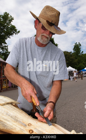 Wood Carver Using Chisel To Shape a Piece of Wood Corydon Indiana Stock Photo
