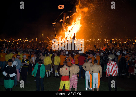 dh Up Helly Aa fire procession LERWICK SHETLAND Guizers torching Viking longship galley Moogi at burning site scotland Stock Photo
