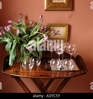 Free-standing tray with flowers and  wine glasses Stock Photo