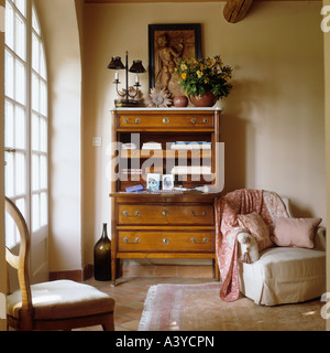 A secretaire or writing bureau with armchair in a French house Stock Photo