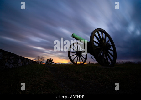 Antietam Battlefield. American Civil War cannons cannon guns at the Final Attack ridge stone wall. Dramatic sky at sunset. Stock Photo